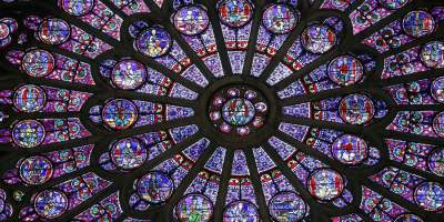 Cosmic wheels of colour … the cathedral’s rose windows. Photograph: Patrick Kovarik/AFP/Getty Images